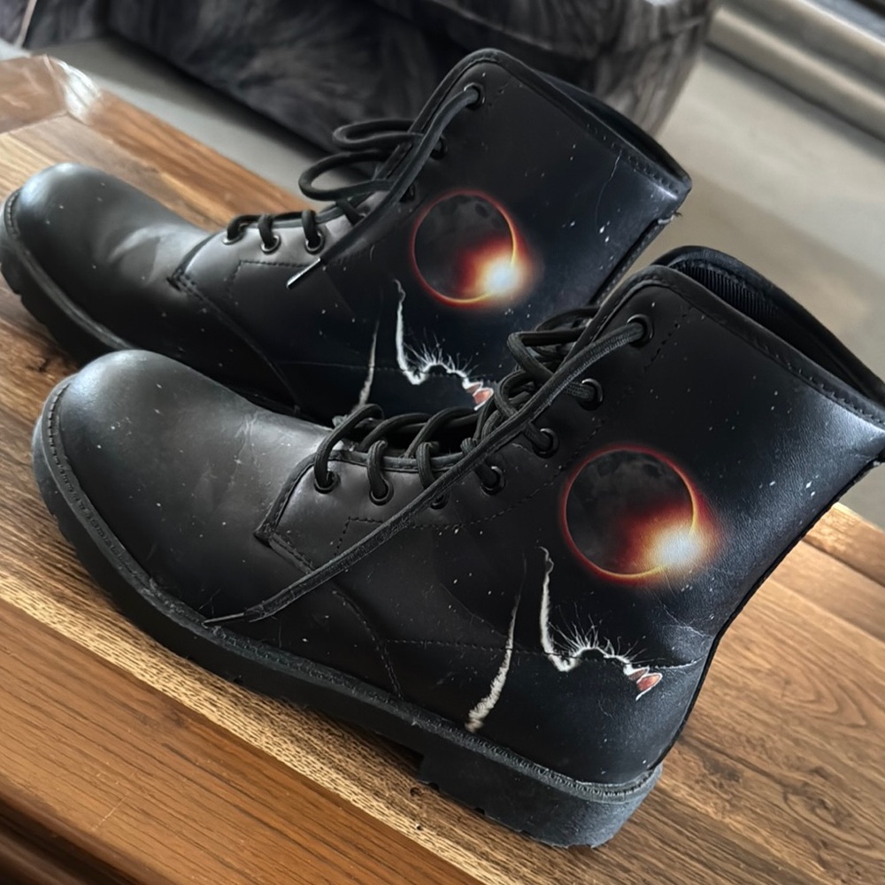 Sleek Black Lace Up Boots with Unique Design